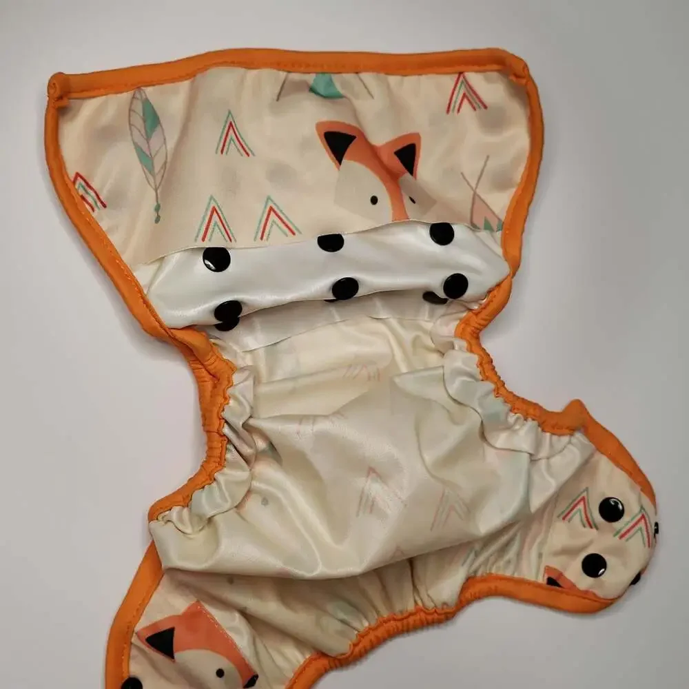 Adjustable Orange-Trim Diaper Cover with Geometric Feather Print